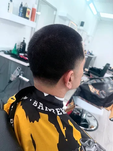Back view of a clean tapered neckline after a haircut at Bladez Affair